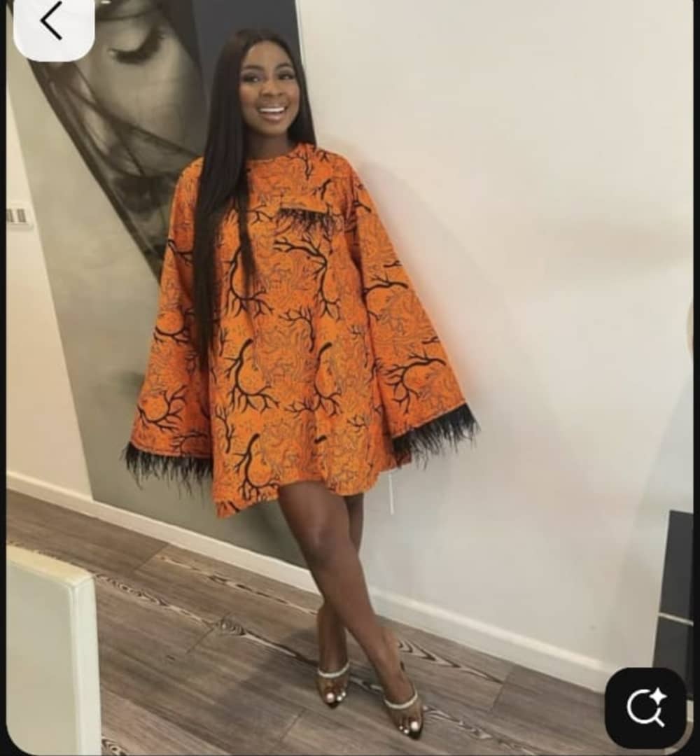 Traditional Ankara dress handcrafted by trafficking survivor in Cameroon - face obscured for privacy