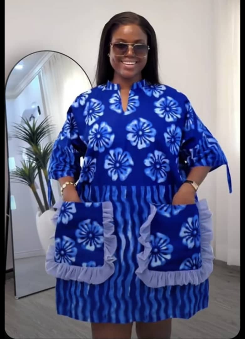 Modern cut African dress handcrafted by rescued woman in Cameroon - identity protected