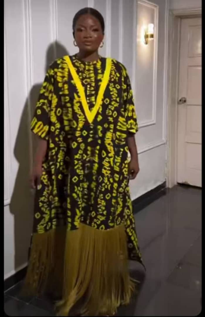 Custom sized African dress handcrafted by abuse survivor - face obscured for safety